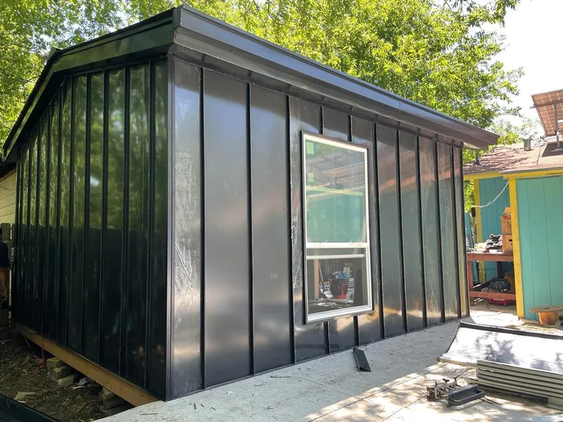 Black standing seam metal wall panels for Roof Inspection in Iowa City