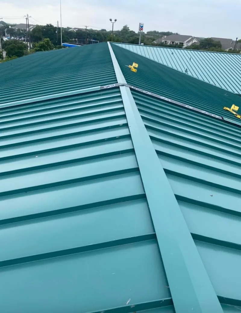 Green commercial metal roof ridge and valley for Metal Roof Repair in Iowa City