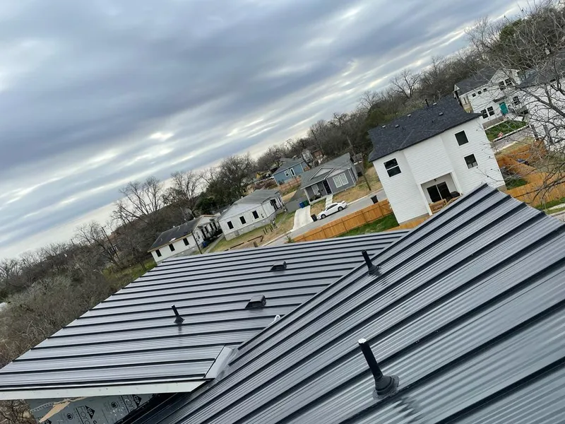 Standing seam metal roof panels with vents for Skylight Repair in Iowa City